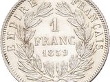 a close up of a coin with a wreath on it