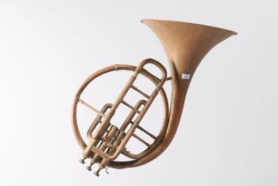 a small brass instrument that is hanging from the ceiling