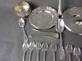 a table with silverware and silverware on it