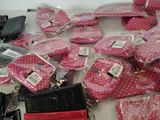 a lot of purses and wallets on the table