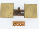 a small wooden box with two buttons on it