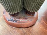 a close up view of a person ' s feet on a wooden table