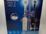 an image of a box of electric toothbrushes on a white surface