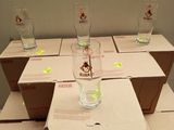 many boxes of wine glasses sitting on top of each other