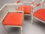 three chairs with red upholstered upholstered cushions on them