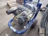 an image of a small engine on a cart