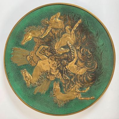 a green plate with a picture of a man riding a horse