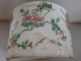 a close up of a white cup with flowers on it