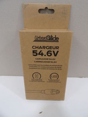 a close up of a cardboard box with a charger inside of it