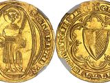 a gold coin with an image of a man holding a shield