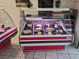 two deli cases with different types of meat in them