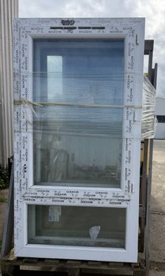 a large white window with writing on it sitting on a pallet