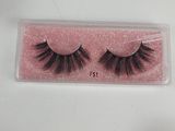 a close up of a pair of false lashes in a plastic box
