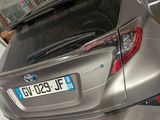a car that is parked in a garage next to another car