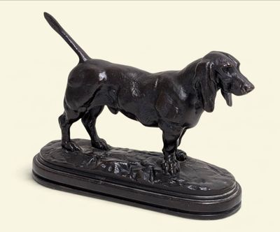 a statue of a dog that is standing on a base