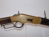 a close up of a rifle on display in a museum