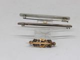 three different types of hair clips sitting on a table