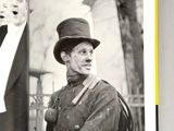a black and white photo of a man in a top hat