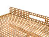 a metal tray with holes on it on a white surface