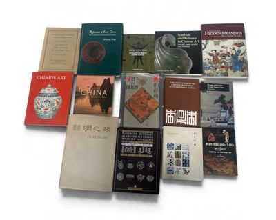 several books on a white surface with a white background