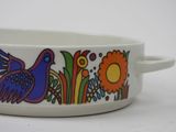 a white bowl with a bird and flowers design on it