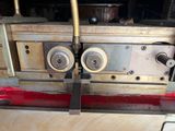 a machine that is working on a piece of wood