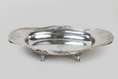 a silver plate with a design on the bottom
