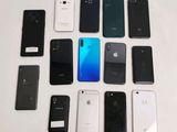 a lot of cell phones that are sitting on a table