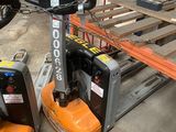two forklifts sitting next to each other in a warehouse