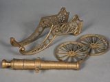 two brass objects that are sitting on a table
