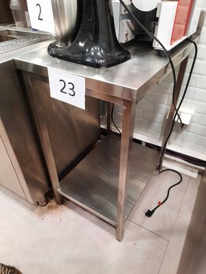 an image of a coffee maker on a table in a kitchen