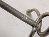 a close up of a metal object on a white surface