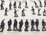 a lot of figurines that are on a table
