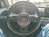 steering wheel of a car with gauges, gauges, and gauges