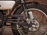 a close up of a motorcycle with a chain attached to it
