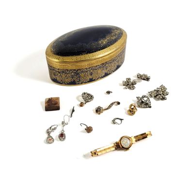 a small box with a lot of jewelry on it
