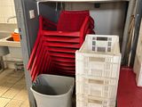 many plastic chairs and bins in a room