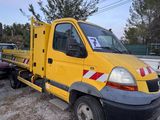 a yellow truck that is parked on the side of the road