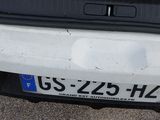 the trunk of a car with a license plate on it