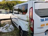 a white van that is parked in the grass