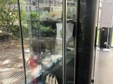a glass display case with a boat inside of it
