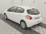 a picture of a white car parked in a garage