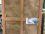 an image of a wooden cabinet with a picture of a plane on it