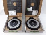 two boxes with two vacuum cleaners inside of them on a white surface