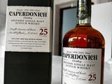 the bottle of the single malt is next to the box of the single malt