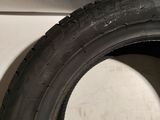 a close up of a tire with a hole in the tire