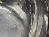 a silver bowl with a handle on a table