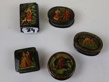 six small decorative boxes are sitting on a white surface