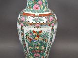 an image of a vase with flowers and birds painted on it