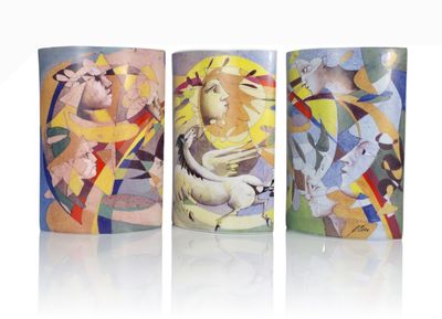 three mugs with different designs on them on a white surface